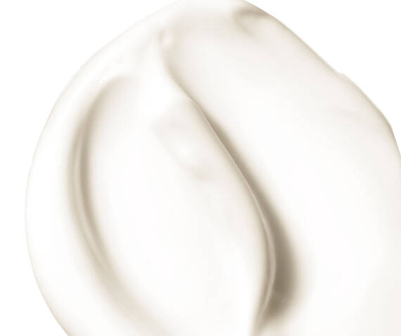 Abstract smear of Tri-Peptide cream texture on a white background